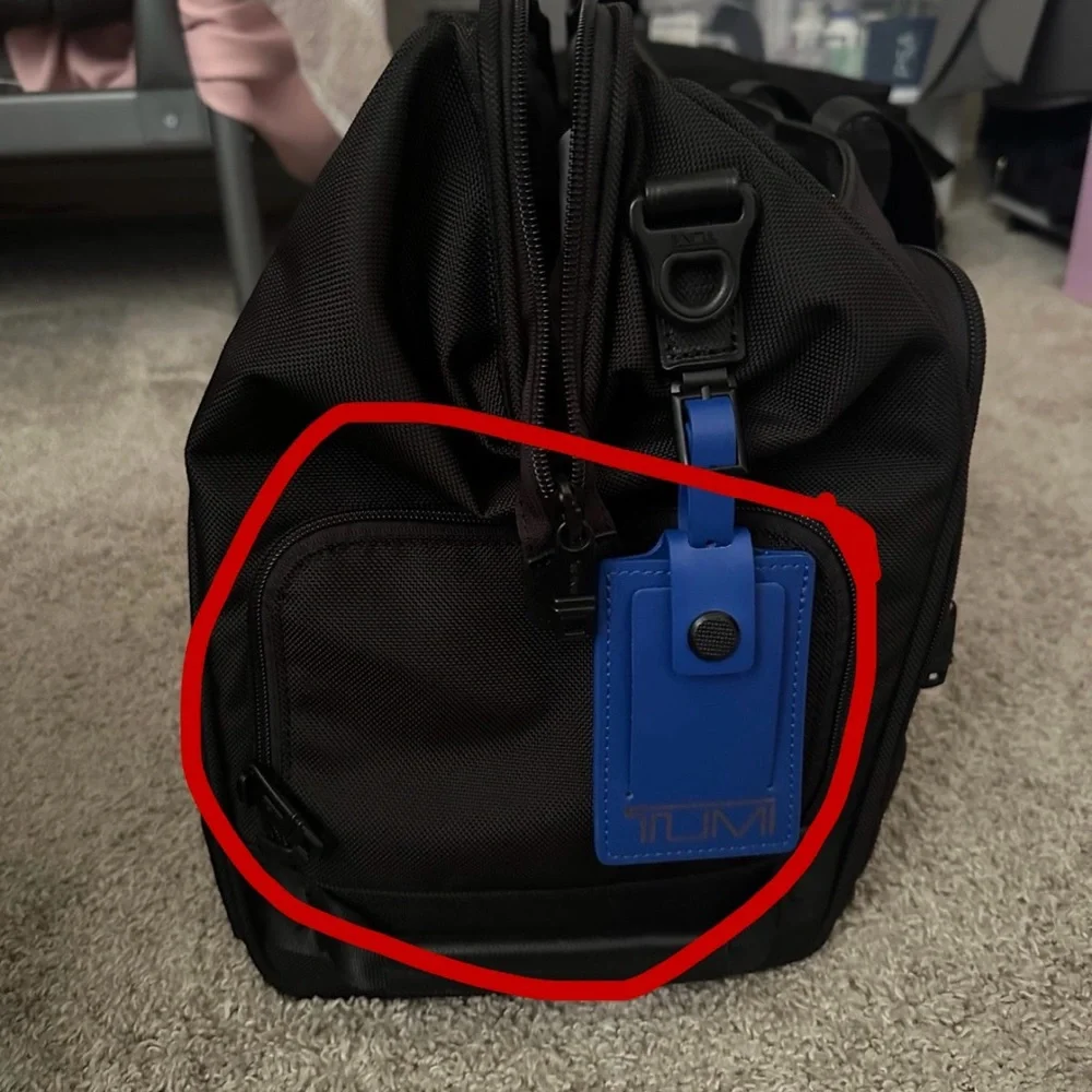 Tumi carry-on bag.